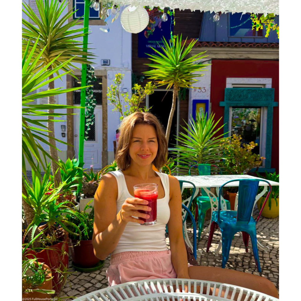 Woman in a Portugese cafe enjoying the weather and nice food in Portugal.